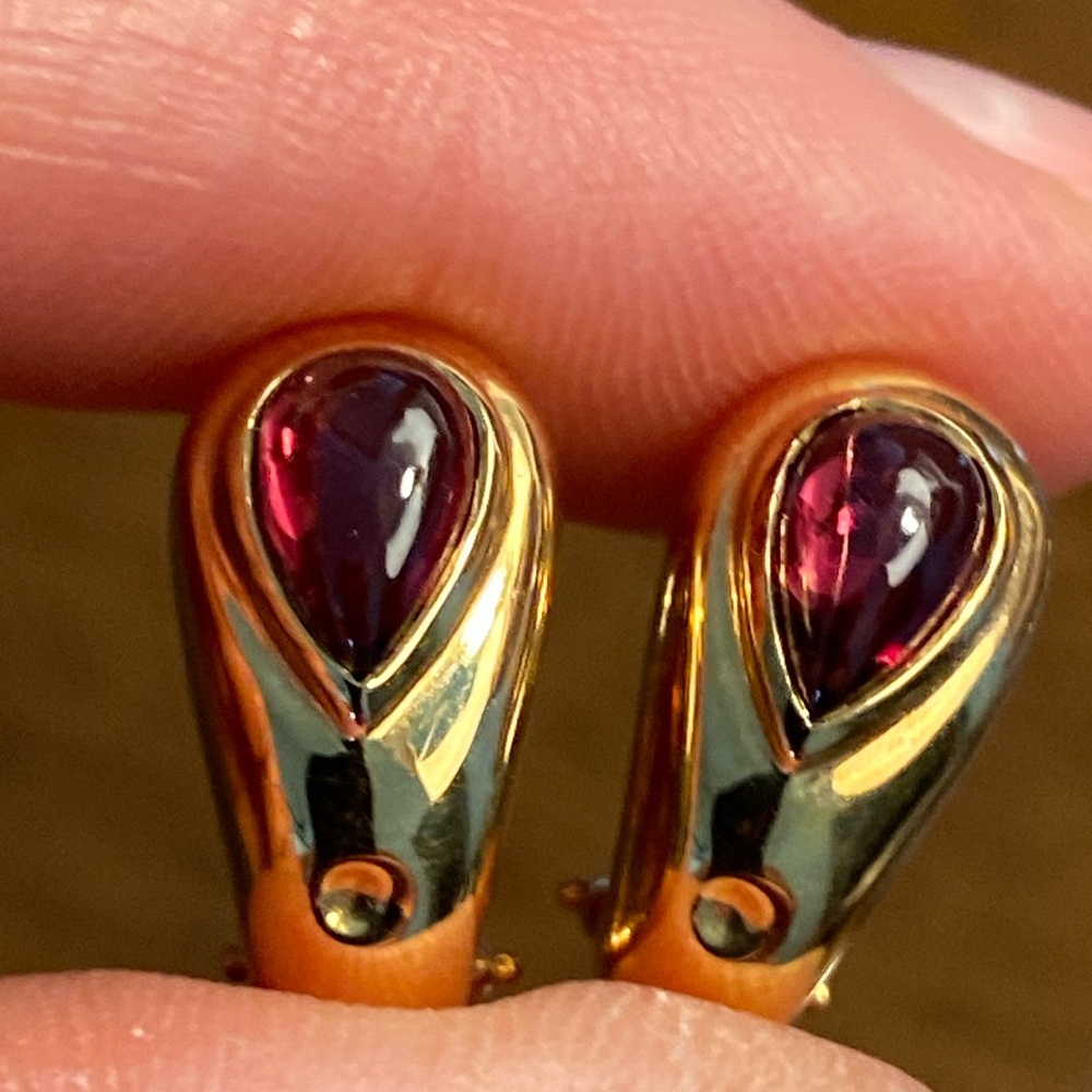 Movado 18 k gold and tourmaline pierced earring.